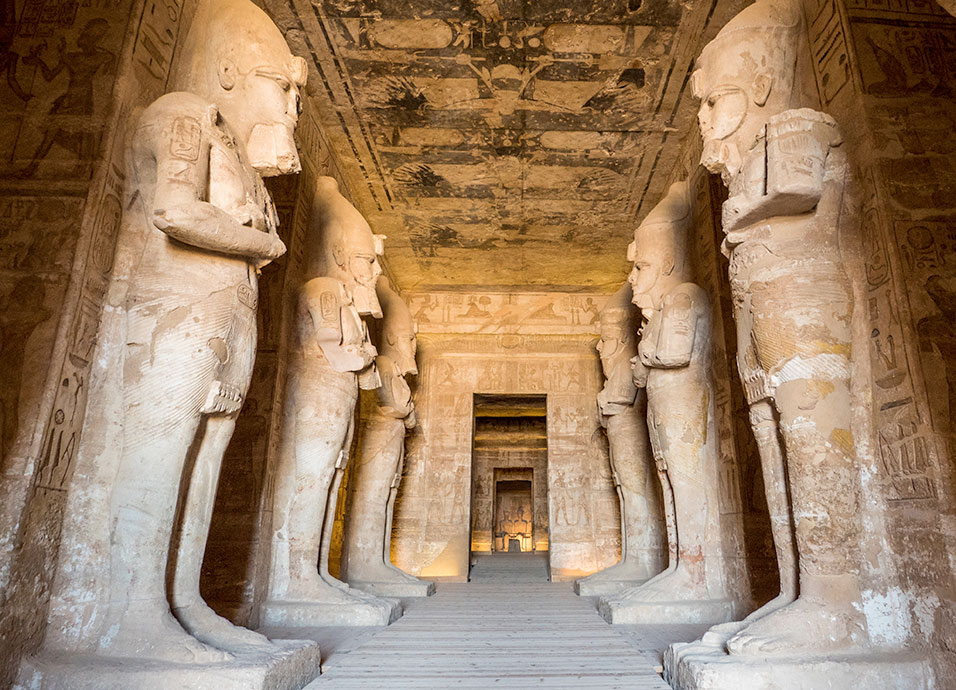 Interior hall of the Great Temple of Ramesses II at Abu Simbel, with monumental statues on both sides